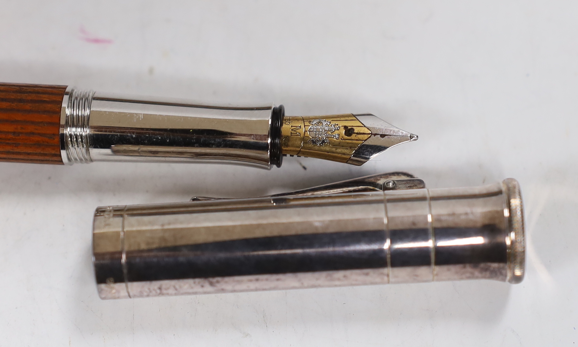 A cased Graf von Faber-Castell fountain pen with wooden handle